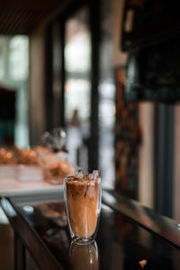 Close-up of coffee in glass on table