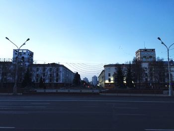 Buildings against clear blue sky