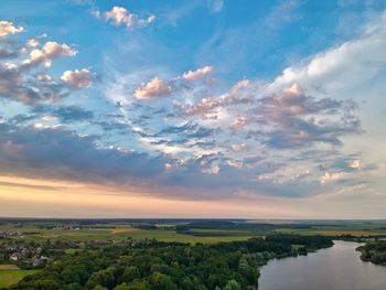 Aerial view of city against sky during sunset