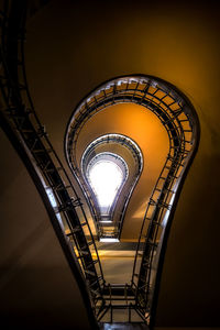 Low angle view of spiral staircase in building