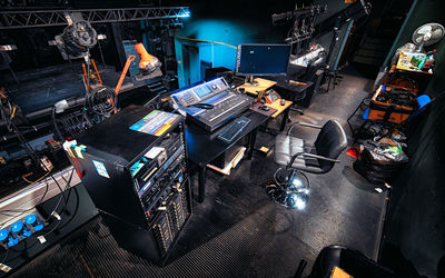 High angle view of illuminated equipment on table at night