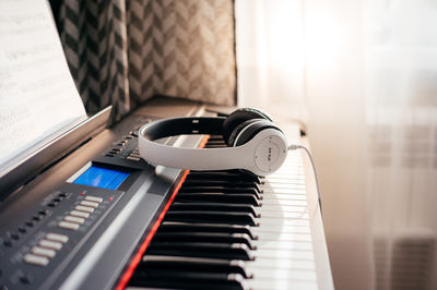 Headphones on musical synthesizer keyboard. headphones on electronic piano