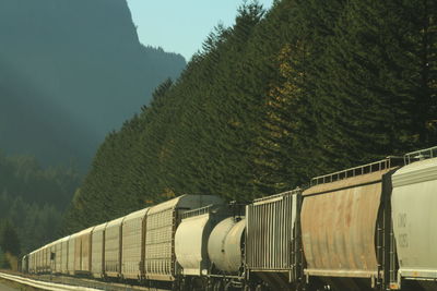 Freight train against mountains