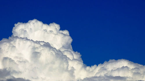 Low angle view of cloudscape against blue sky