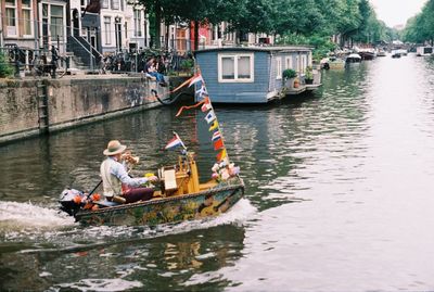 People sitting on boat in river