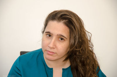 Portrait of woman against white background