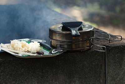 Close-up of food in plate on retaining wall