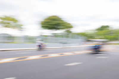 Blurred motion of car on road