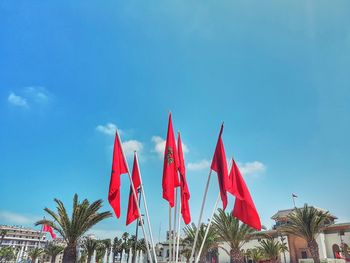 Red flags against blue sky