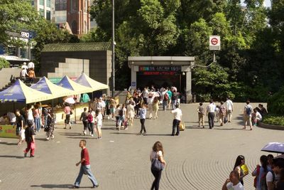 People walking on street in city