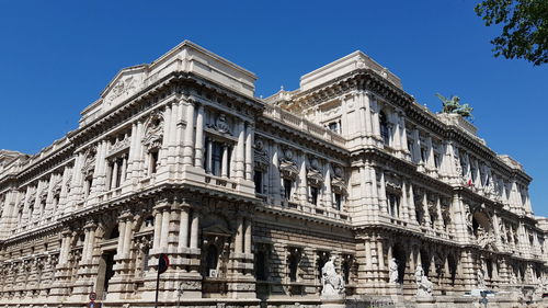 Low angle view of building against blue sky