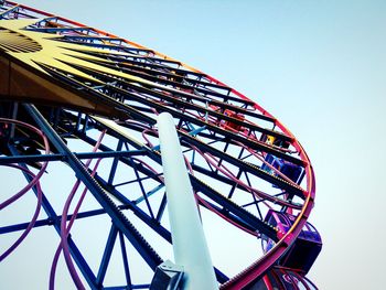 Low angle view of ferris wheel against sky