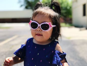 Portrait of cute girl wearing sunglasses