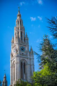 Low angle view of historical building against blue sky