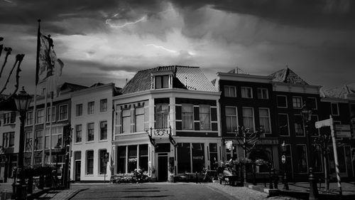Residential buildings against sky at dusk