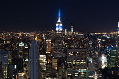 Illuminated buildings in city at night