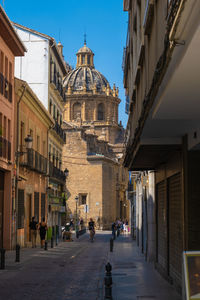 People walking on street in city