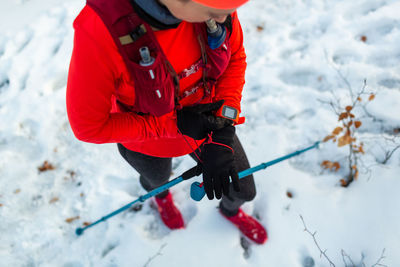 Low section of man skiing on snow