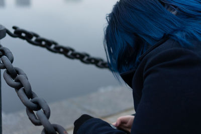 Close-up of woman holding rope