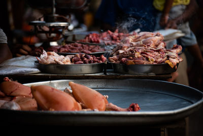 Close-up of meat on barbecue grill in market