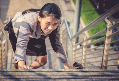 Woman moving up on steps