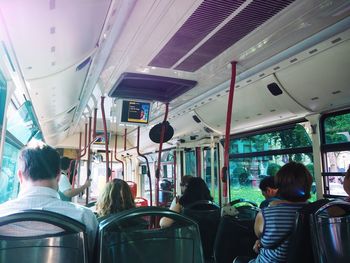 Rear view of people sitting in bus