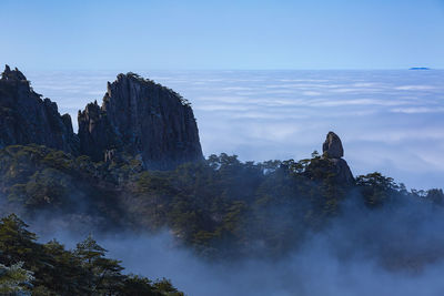 Scenic view of rock formations against sky