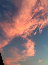 Low angle view of cloudy sky at sunset