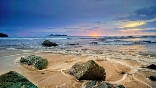 Scenic view of sea against sky during sunset