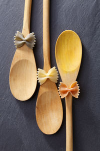 Directly above shot of farfalle pastas on spoons