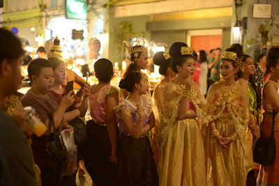 Group of people at market stall