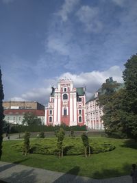 Building against cloudy sky