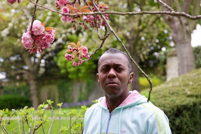 Portrait of man standing at park