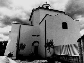 Low angle view of bell tower against sky