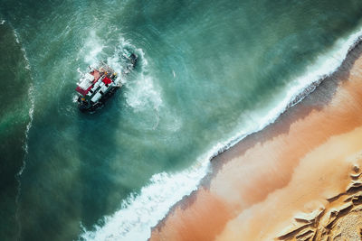 High angle view of man surfing in sea