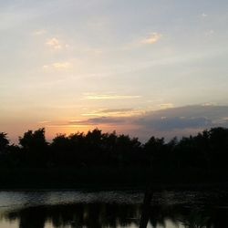 Scenic view of lake at sunset