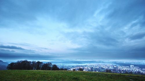 Scenic view of landscape against cloudy sky