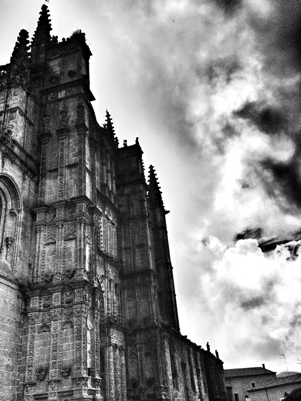 sky, architecture, low angle view, built structure, building exterior, cloud - sky, history, statue, sculpture, art and craft, religion, human representation, art, cloudy, place of worship, spirituality, famous place, travel destinations, old