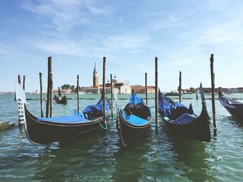 Boats moored in water