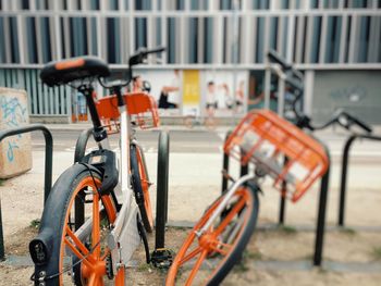 Close-up of bicycle parked in row