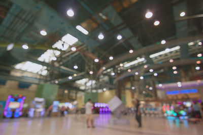 Low angle view of illuminated lights at ceiling