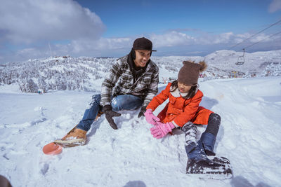 Portrait of woman skiing on snow