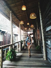 Full length of woman walking in balcony