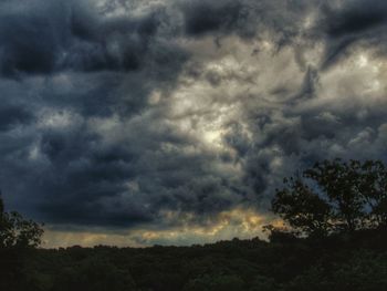 Low angle view of storm clouds over dramatic sky