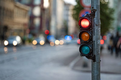 Illuminated road sign on city street