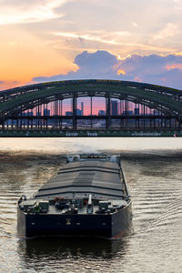 Scenic view of river against sky during sunset