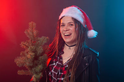 Portrait of beautiful young woman in red hat