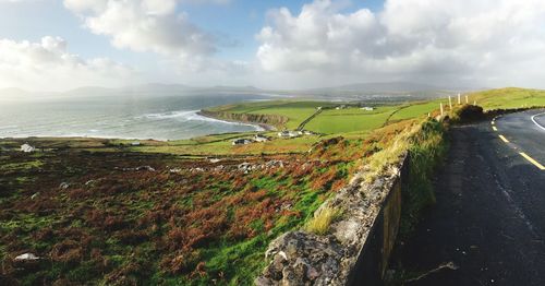 Panoramic view of road by sea against sky