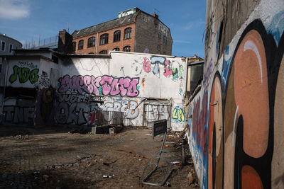 Graffiti on building against sky