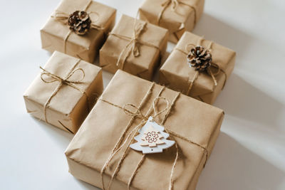 High angle view of christmas presents on white table